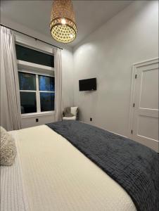 a bedroom with a large bed and a window at Countryside Casita in Rigby