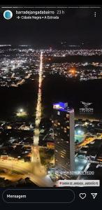 a view of a city at night with a building at Luxury Paiva Flat in Recife
