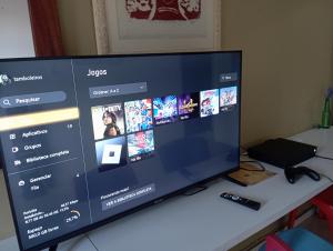 TV a/nebo společenská místnost v ubytování Tamboleiros Hotel & Hostel