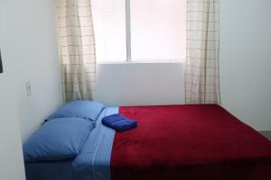 Postel nebo postele na pokoji v ubytování Living Poblado Manila 3028 Habitación Doble