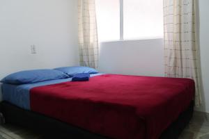 Postel nebo postele na pokoji v ubytování Living Poblado Manila 3028 Habitación Doble