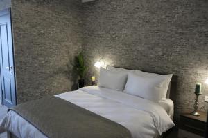 Postel nebo postele na pokoji v ubytování Hotel Saguramo Bliss