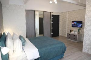 Postel nebo postele na pokoji v ubytování Hotel Saguramo Bliss