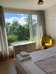 A bed or beds in a room at Kokhta guest house On the mountain