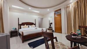 Postel nebo postele na pokoji v ubytování Hydrangea Heights by PTW Hotels