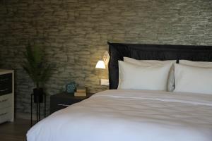 Postel nebo postele na pokoji v ubytování Hotel Saguramo Bliss