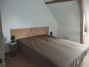 Postel nebo postele na pokoji v ubytování Autour des lacs