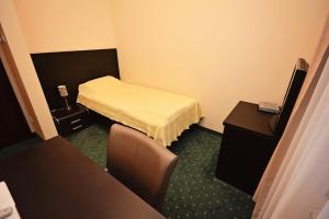 Ένα ή περισσότερα κρεβάτια σε δωμάτιο στο Kaštel Hotel