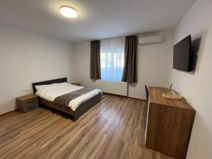 TV a/nebo společenská místnost v ubytování Salin Home