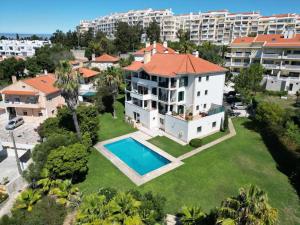 an aerial view of a house with a swimming pool at Casa do Mar Cascais in Alcabideche