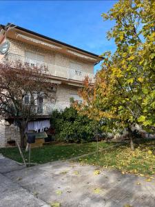 a house with a tree in front of it at app Leka in Umag
