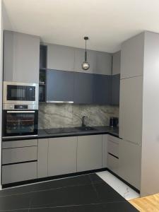 Kuchyň nebo kuchyňský kout v ubytování Apartman Sarah