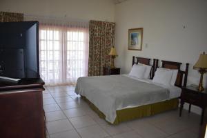 Postel nebo postele na pokoji v ubytování Caribbliss Suites + 35 fotografií