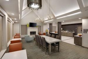 a dining room with a table and chairs at Residence Inn Indianapolis Airport in Indianapolis