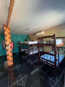 Postel nebo postele na pokoji v ubytování Hostel Caiçara