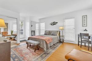 a bedroom with a bed and a living room at Historic Spanish Home at Hollywood Beach in Oxnard
