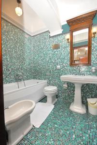 a bathroom with a tub and a toilet and a sink at Appartmento Ca' Rio Marin in Venice