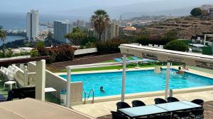 a swimming pool on the roof of a building at Zen Ocean View House Tenerife in Los Realejos