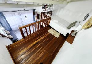 an overhead view of a room with a wooden staircase at Apartaestudio De La Villa in Villa de Leyva