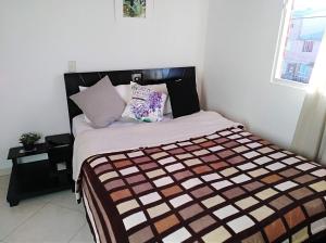 Postel nebo postele na pokoji v ubytování HABITACIÓN EN SUBA, Bogotá