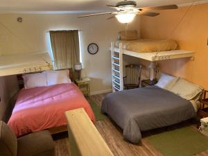 A bed or beds in a room at Mancos Inn