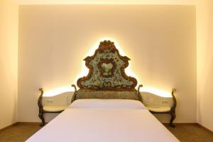 Posteľ alebo postele v izbe v ubytovaní Hotel Cal Piteu