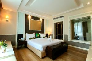 Ein Bett oder Betten in einem Zimmer der Unterkunft A-Te Chumphon Hotel - SHA Plus