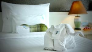 Ein Bett oder Betten in einem Zimmer der Unterkunft A-Te Chumphon Hotel - SHA Plus