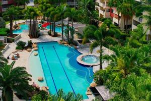 an aerial view of a swimming pool at a resort at Spacious Apt with pool & parking in Brisbane