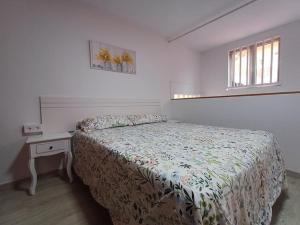 Ένα ή περισσότερα κρεβάτια σε δωμάτιο στο Apartament Playa de la Garita