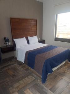 Postel nebo postele na pokoji v ubytování Hotel Dalia