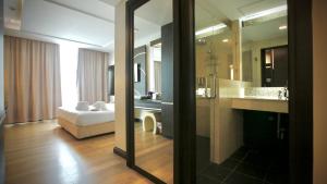 Ein Bett oder Betten in einem Zimmer der Unterkunft A-Te Chumphon Hotel - SHA Plus