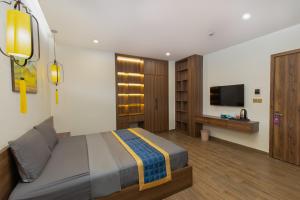 TV a/nebo společenská místnost v ubytování Hai Hội Villa Hoi An