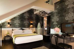 Llit o llits en una habitació de Hotel Design Sorbonne