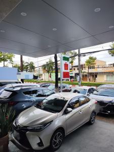 a group of cars parked in a gas station at KHÁCH SẠN VĂN KHANG in Bạc Liêu +47 photos