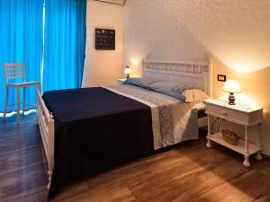 Postel nebo postele na pokoji v ubytování B&B Casa Rossella