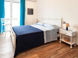 Postel nebo postele na pokoji v ubytování B&B Casa Rossella