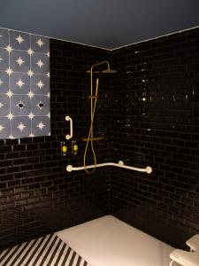 a bathroom with an american flag on the wall at Maison Primado B&B in Valencia