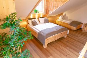 a bedroom with two beds in a attic at Florineum in Weyregg +24 photos