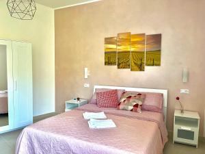 Postel nebo postele na pokoji v ubytování Il Vigneto Suite