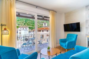 Televisyen dan/atau pusat hiburan di Encantos del Jerte Apartamentos