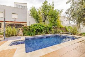 a swimming pool in the yard of a house at Hort de la Cinteta in Alcover