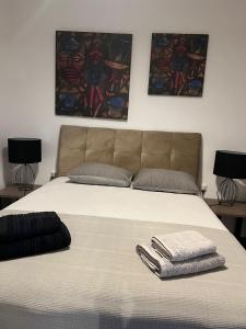 a large bed with two pillows on top of it at Sea View Residence by MD in Alexandroupoli