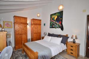 Postel nebo postele na pokoji v ubytování Cortijo Los Santeros + 37 fotografií