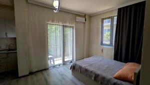 Voodi või voodid majutusasutuse Hotel Palm Gonio toas