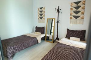 Postel nebo postele na pokoji v ubytování Jesselton Quay Seaview Homestay near Suria Sabah by StayPlace