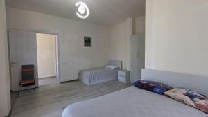 Voodi või voodid majutusasutuse Hotel Palm Gonio toas