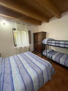 Postel nebo postele na pokoji v ubytování Casa di nonno Agostino