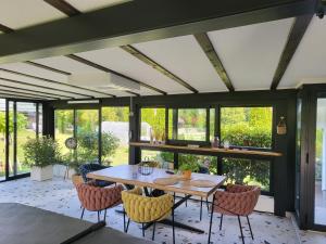 a dining room with a table and chairs at ANTICA in Vrh nad Želimljami