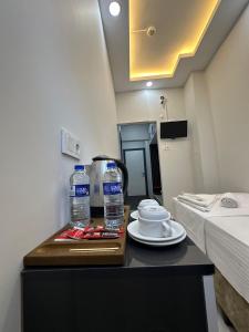 a room with a table with two bottles of water at Kosova Hotel in Istanbul
